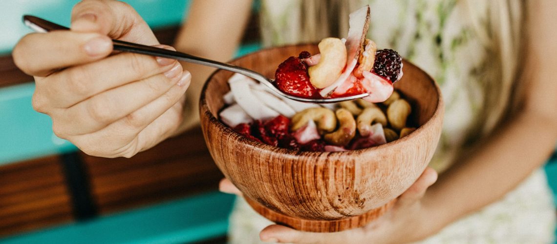 person-holding-stainless-steel-spoon-with-sliced-3622474-min